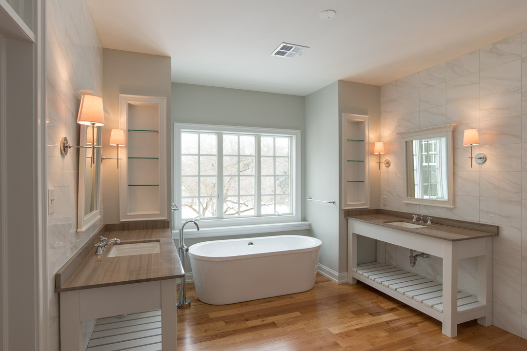 Winslow Interiors - bathroom with dual vanities and marble backsplash
