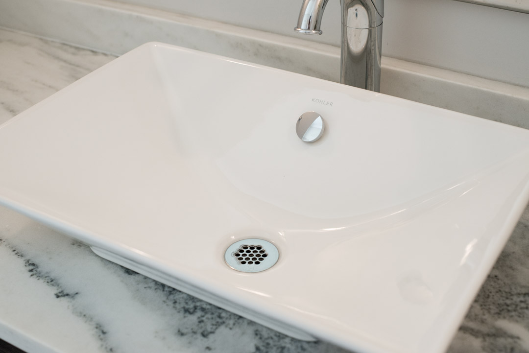 Winslow Interiors Interior Design - vessel sink on top of marble vanity
