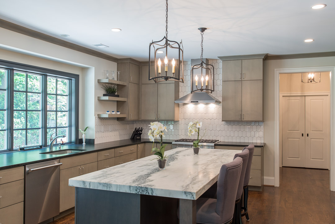 Newtown Square custom home kitchen with granite island and candle style lighting