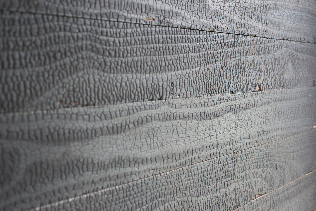 Textured charred wood panel detail