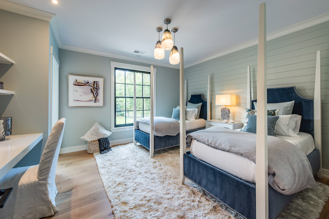 Philadelphia Magazine Design Home 2019 bedroom with wood panel walls and four post beds