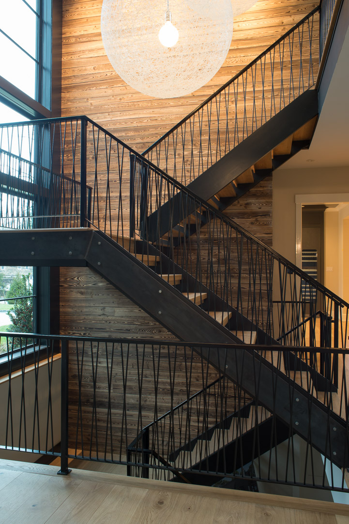 Iron and wood staircase with lighting design