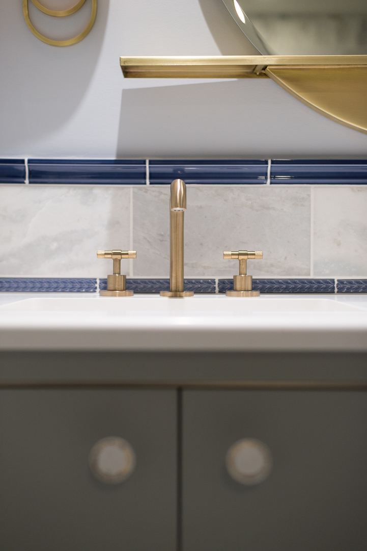 Winslow Interiors - Brass sink faucet with tile backsplash